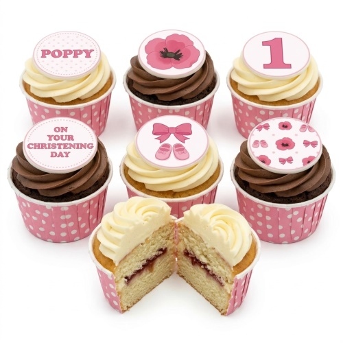 Pink and white cupcakes with baby shoes, bows, poppy flowers, custom age '1' and 'On Your Christening Day' toppers.
