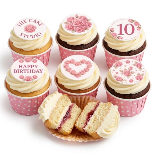 Six cupcakes with white frosting and pink rose-themed edible toppers, some with 'Happy Birthday' and a custom age.