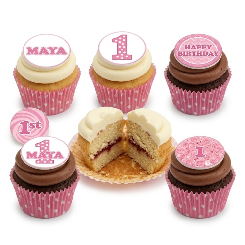 Pink and white cupcakes with '1' and 'Happy Birthday' toppers, in polka dot wrappers.