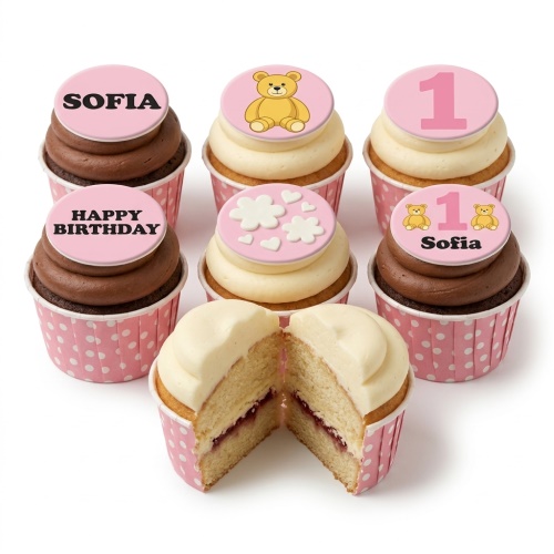 Pink cupcakes with teddy bear, hearts, and custom age '1' and name 'Sofia' toppers.
