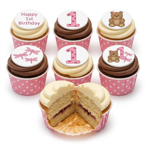 Pink 1st birthday cupcakes with teddy bears, dragonflies, and 'Happy 1st Birthday' toppers.