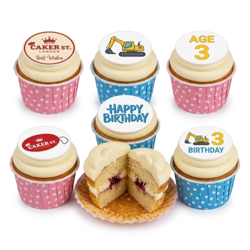 White cupcakes with cream frosting, some with digger toppers and others with 'Happy Birthday' and custom age text.