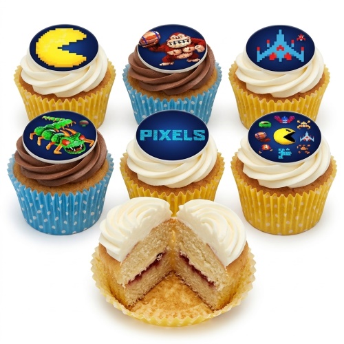 Set of six cupcakes with pixel art gaming toppers including Pac-Man, Donkey Kong, Space Invaders, and 'PIXELS' text, in yellow and blue cases.