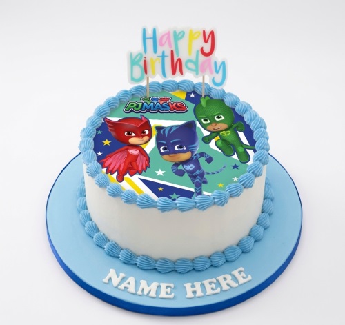 Round PJ Masks birthday cake with Catboy, Owlette, Gekko edible image and personalised name on board.