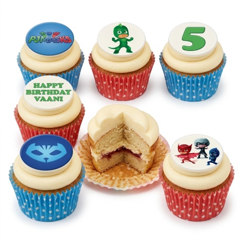 PJ Masks themed birthday cupcakes with white frosting, red and blue polka dot cases, and edible character toppers.