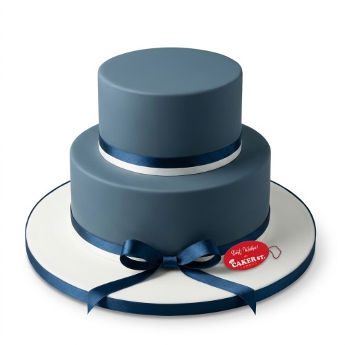 Elegant two-tier adult birthday cake with smooth blue-grey fondant and classic blue and white ribbons.