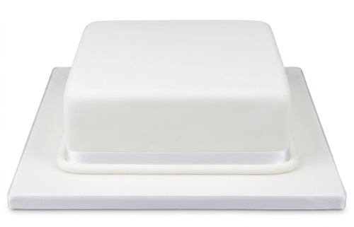 White square plain iced cake with a white ribbon on a white cake board.