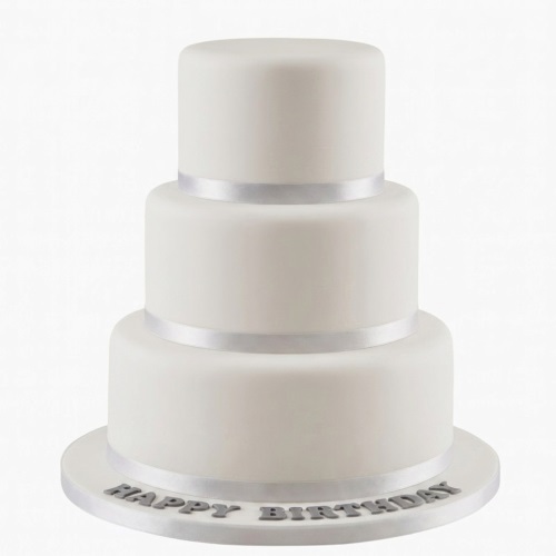 Elegant three-tiered white fondant cake with silver ribbon and 'Happy Birthday' message on the board.