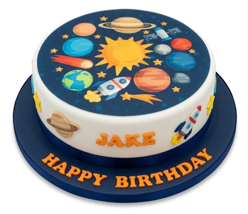Round white cake with a dark blue space theme top, featuring planets, sun, stars, and rockets, with 3D rocket and Saturn decorations on the side.