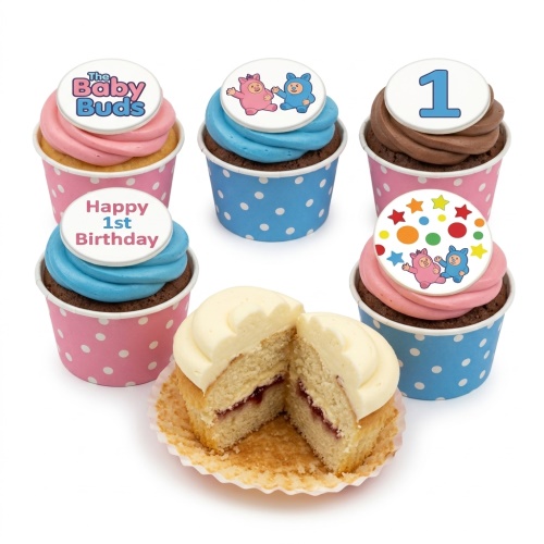 A set of pink and blue cupcakes with "The Baby Buds" characters, "1" and "Happy 1st Birthday" toppers, one cupcake cut to show vanilla sponge and jam filling.