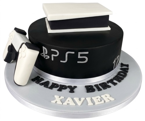 Black and white PS5 themed birthday cake with console, controller, and custom age.