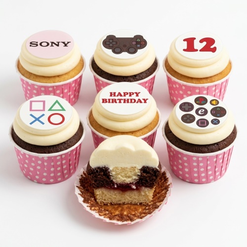 PlayStation themed birthday cupcakes with controller, symbols, and 'Happy Birthday' toppers.