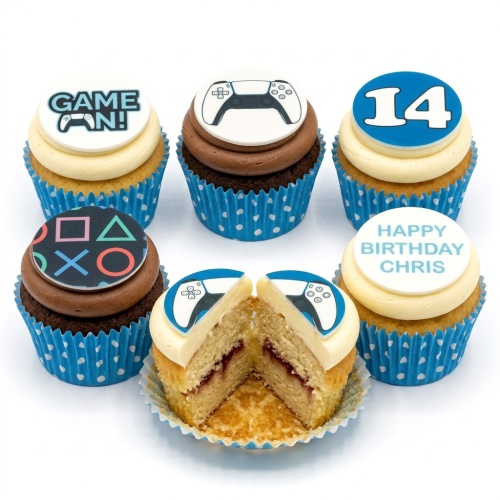 Gaming themed cupcakes with white and brown icing, controller toppers, and a custom age number.