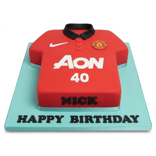 Red Manchester United football shirt shaped birthday cake with custom age and name area.
