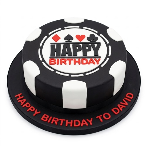 Round black and white poker chip birthday cake with card suits and 'Happy Birthday' text, with a personalised message on the board.