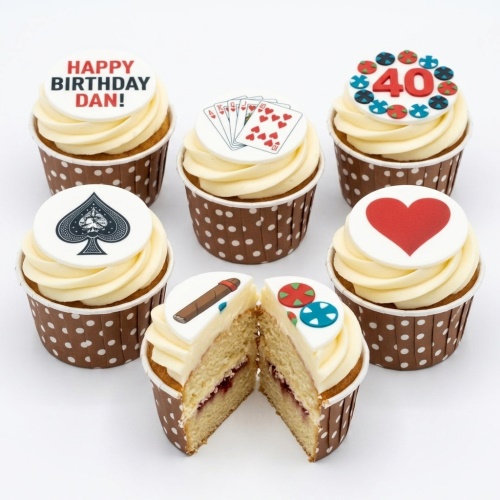 Cupcakes with casino theme toppers including poker cards, spade, heart, cigar, and poker chips.