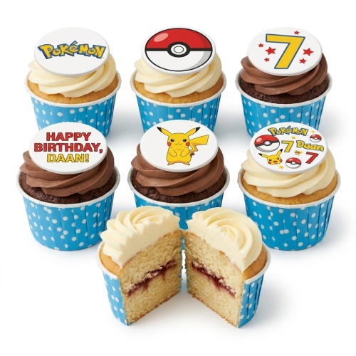 Pokémon themed cupcakes with Pikachu, Poké Ball, and logo toppers, some with chocolate and vanilla frosting, in blue polka dot cases.