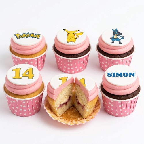 Six Pokémon theme cupcakes with pink frosting, white toppers, custom age 14, and name Simon.