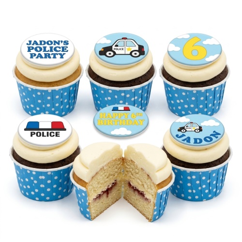 Cupcakes with blue wrappers, white icing, and police theme toppers including police cars, sirens, and a custom age number.