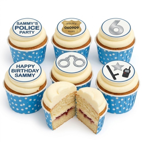Vanilla cupcakes with white frosting and blue polka dot cases, topped with edible police theme decorations and a custom age number.