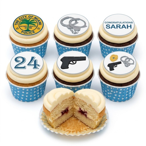 Police theme birthday cupcakes with badge, handcuffs, pistol, and custom age toppers.