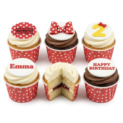 Minnie Mouse themed birthday cupcakes with red polka dot bows, a custom age '2' topper, and a personalised 'Emma' name topper.