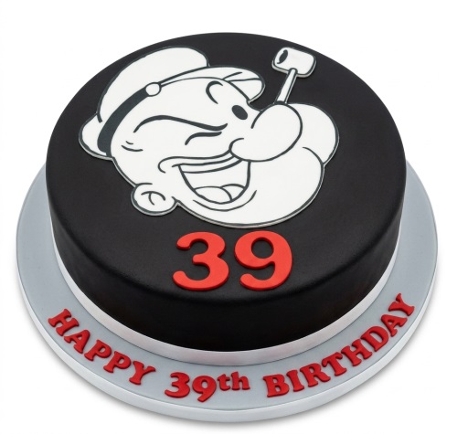 Round black birthday cake with a white Popeye character outline and red custom age numbers.