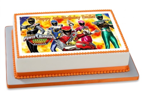 Rectangular white cake with orange trim and a Power Rangers Dino Charge edible image for a custom age birthday.
