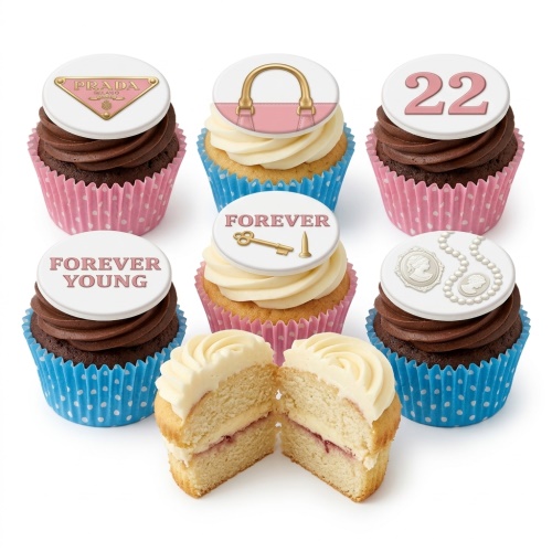 Designer birthday cupcakes with fashion-themed toppers, including a handbag, luxury logo, cameo, pearls, and custom age number.