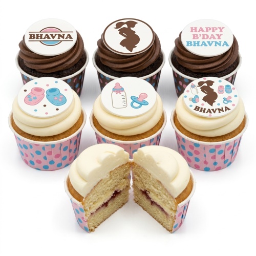 Cupcakes with baby shower toppers including pregnant silhouette, baby bottle, pacifier, booties, and custom name.