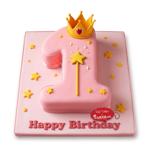 Pink number one shaped cake with a golden crown, magic wand, and stars for a 1st birthday.