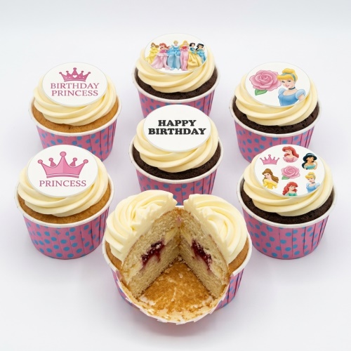Assortment of Disney Princess themed birthday cupcakes with crowns and "Happy Birthday" toppers.