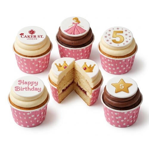 Pink polka dot cupcakes with princess, crown, and custom age toppers.