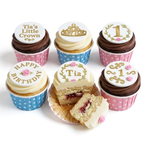 Princess crown and floral birthday cupcakes with custom age and name toppers in pink and blue wrappers.