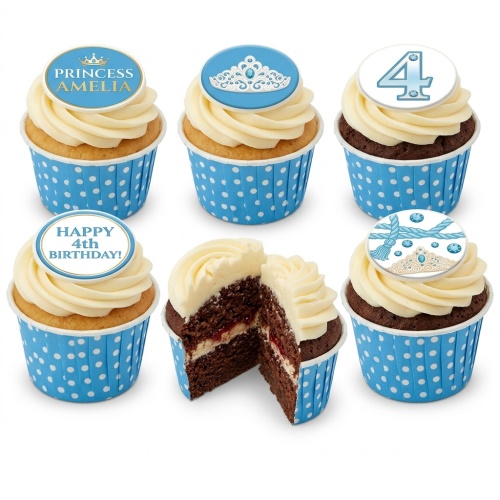 Princess themed cupcakes with tiara and crown toppers, blue polka dot wrappers, and swirled white frosting.