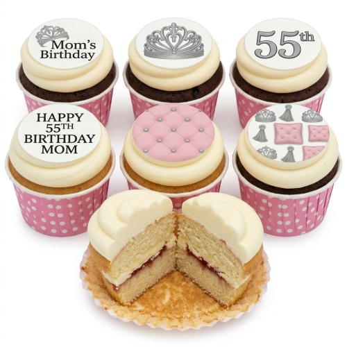 Cupcakes with white frosting, pink polka dot wrappers, and toppers featuring silver crowns, pink quilted patterns, and custom birthday messages.