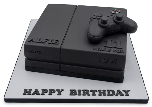Black PlayStation 4 console cake with edible controller and custom age topper.