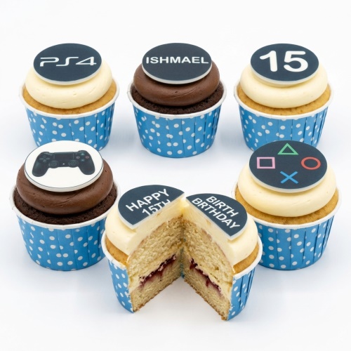 PlayStation themed birthday cupcakes with PS4 logo, controller, and gaming symbols. Features custom age topper and personalised name example.