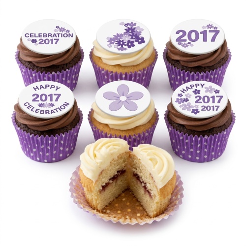 A selection of purple floral celebration cupcakes with custom year toppers and polka dot wrappers.