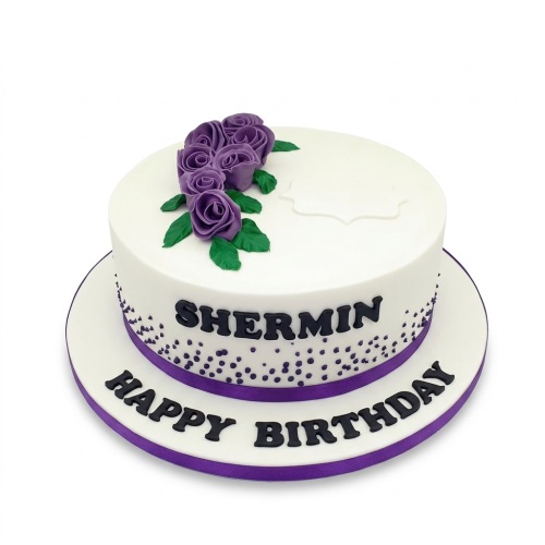 Round white birthday cake decorated with purple sugar roses, green leaves, purple sprinkles, and a purple ribbon, with space for a custom name and message.