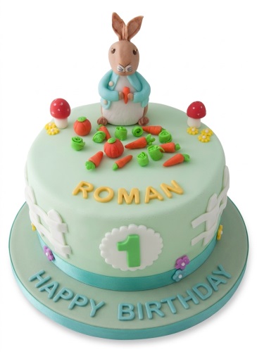 Light green round cake with 3D rabbit topper, carrots, mushrooms, fence, personalised name, and custom age topper.