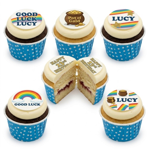 Cupcakes with white frosting, blue polka dot cases, and edible rainbow, pot of gold, and good luck toppers.