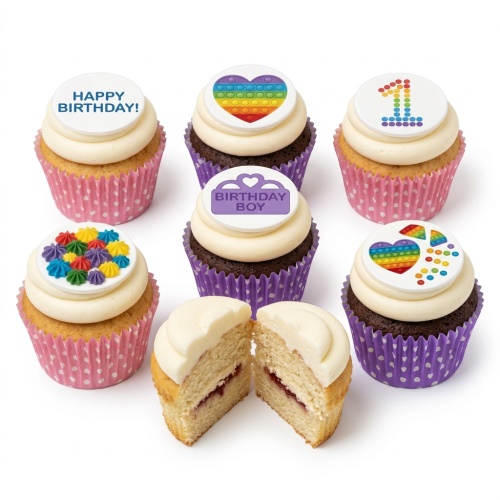 Cupcakes with white frosting, Pop It fidget toy designs, rainbow number 1, 'Happy Birthday!' and 'Birthday Boy' toppers, and colourful sprinkles.