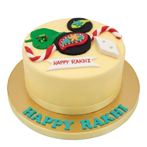 Round yellow cake decorated with a rakhi motif, green betel leaf, candy canes, and "Happy Rakhi" message.