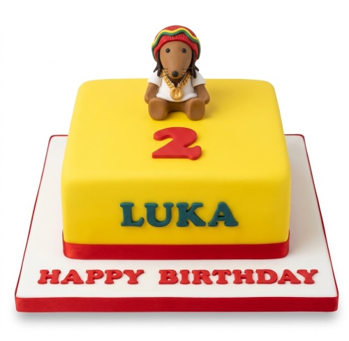 Yellow square cake with a rasta dog character, red custom age number, and personalised name.