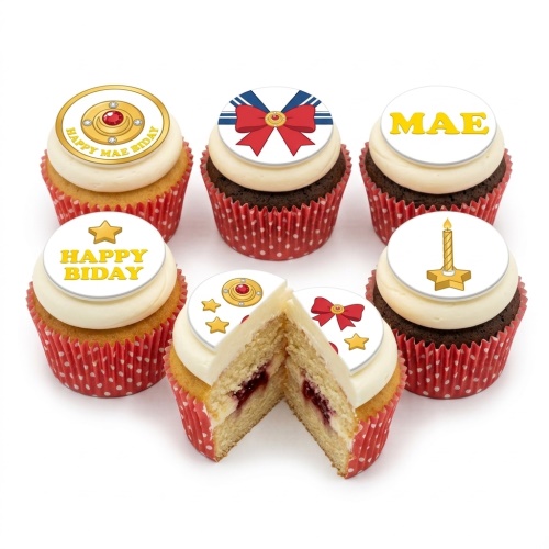 Sailor Moon themed cupcakes with white frosting, red polka dot cases, and edible toppers featuring a brooch, bow, star, and candle.