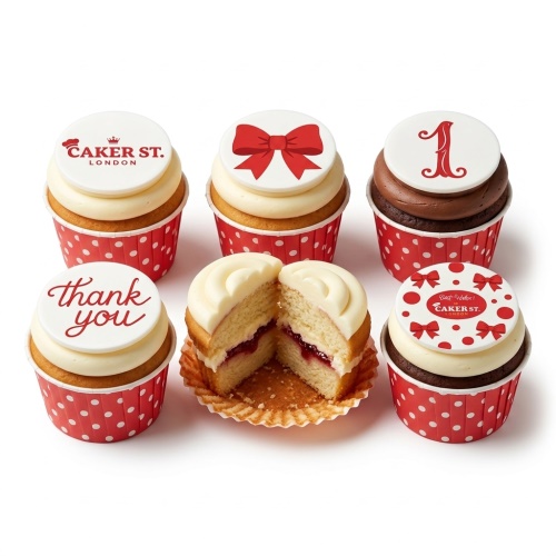 Six cupcakes with red polka dot wrappers, white frosting, and red bow and custom message toppers.