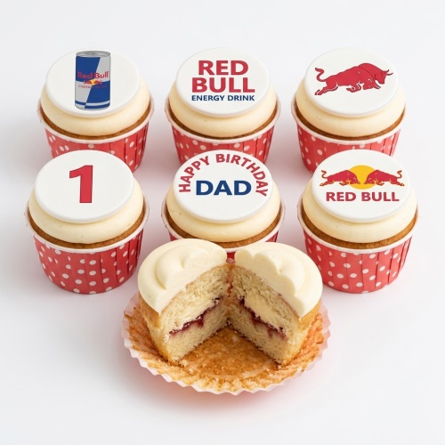 Six Red Bull themed cupcakes with white frosting and red polka dot cases. One has '1', another 'Happy Birthday Dad'.