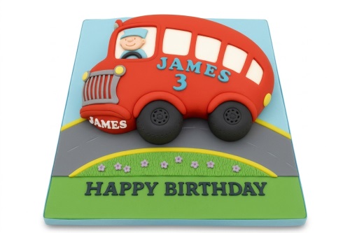 Red bus themed birthday cake with a driver, road, grass, and sky background, designed for a child's celebration.