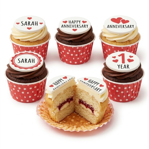 Cupcakes with red heart and custom message toppers in red polka dot cases.